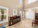 Inviting living room features fireplace, two-story ceilings, and neutral color palette at 10612 Gum Tree Ct, Las Vegas, NV 89144