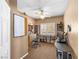 Well-lit office features a ceiling fan, window with shutters, and organized shelving at 10612 Gum Tree Ct, Las Vegas, NV 89144