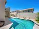Private pool and lounge area with a lush garden and exterior view at 10612 Gum Tree Ct, Las Vegas, NV 89144