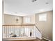 Bright stairway with white railings to the second story of the home at 10612 Gum Tree Ct, Las Vegas, NV 89144