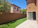 Backyard featuring artificial turf at 11185 Saddle Iron St, Las Vegas, NV 89179