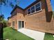 Backyard featuring artificial turf, patio, and siding doors at 11185 Saddle Iron St, Las Vegas, NV 89179