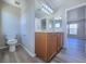 Bathroom features a double sink vanity with drawers and modern lighting at 11185 Saddle Iron St, Las Vegas, NV 89179