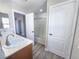 Bright bathroom featuring double sinks, a large mirror, and a shower/tub combo at 11185 Saddle Iron St, Las Vegas, NV 89179