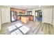 Bright kitchen features stainless steel appliances, wood cabinets and island with open floor plan at 11185 Saddle Iron St, Las Vegas, NV 89179