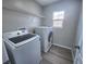 Functional laundry room with modern washer and dryer and convenient storage shelving at 11185 Saddle Iron St, Las Vegas, NV 89179
