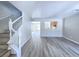 Spacious living room featuring open floor plan, new light wood floors, and natural light at 11185 Saddle Iron St, Las Vegas, NV 89179