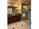 Modern bathroom featuring double sinks, a large mirror, and a walk-in shower for added convenience at 125 E Harmon Ave # 2918, Las Vegas, NV 89109