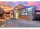 Spacious backyard featuring pavers, covered patio with a fountain, and strip of artificial turf at 12816 Alcores St, Las Vegas, NV 89141