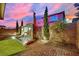 Inviting backyard featuring a modern water feature, landscaping, and hardscape, creating a private retreat at 12816 Alcores St, Las Vegas, NV 89141