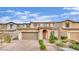 Charming two-story home with a brick driveway, attached two-car garage, and manicured landscaping at 12816 Alcores St, Las Vegas, NV 89141