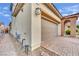 A brick driveway leads to the two-car garage on this home at 12816 Alcores St, Las Vegas, NV 89141