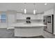 Spacious kitchen featuring a large island and stainless steel appliances for a modern touch at 12816 Alcores St, Las Vegas, NV 89141