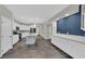 Open kitchen with stainless appliances, a large island, and sleek countertops at 12816 Alcores St, Las Vegas, NV 89141