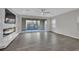 Open living room with tile flooring, electric fireplace, and access to outdoor space at 12816 Alcores St, Las Vegas, NV 89141