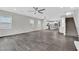 Bright and airy living room with tile floors, a view of the kitchen, and a staircase at 12816 Alcores St, Las Vegas, NV 89141