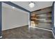 This office features a statement wood wall, with tile floors and neutral paint at 12816 Alcores St, Las Vegas, NV 89141