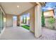 Covered patio space that includes a fountain, turf and patio furniture at 12816 Alcores St, Las Vegas, NV 89141