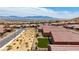Aerial shot of neighborhood featuring single-story homes, desert landscaping, and distant mountains at 1398 Pin Cushion Rdg, Mesquite, NV 89034