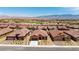 Bird's eye view of a neighborhood showcasing single-story homes and landscaped streets at 1398 Pin Cushion Rdg, Mesquite, NV 89034