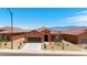 Wide shot featuring a row of single-story homes set against a backdrop of distant mountains at 1398 Pin Cushion Rdg, Mesquite, NV 89034