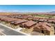 Panoramic aerial shot features a community with single-story homes set amongst a desert landscape at 1398 Pin Cushion Rdg, Mesquite, NV 89034