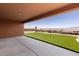 Inviting covered patio with a manicured lawn and scenic mountain views at 1398 Pin Cushion Rdg, Mesquite, NV 89034
