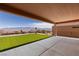 Enjoy the covered patio with lush artificial grass and mountain views at 1398 Pin Cushion Rdg, Mesquite, NV 89034
