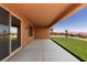 A covered patio with views of the landscaped backyard at 1398 Pin Cushion Rdg, Mesquite, NV 89034