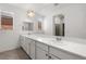 Bright bathroom featuring a double sink vanity with a white countertop and natural lighting at 1398 Pin Cushion Rdg, Mesquite, NV 89034