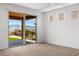 Bright bedroom with a sliding glass door and view of the outdoors at 1398 Pin Cushion Rdg, Mesquite, NV 89034