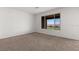 Bedroom with carpet floor and window view at 1398 Pin Cushion Rdg, Mesquite, NV 89034