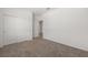 Bedroom with carpeted floor, closet, and door at 1398 Pin Cushion Rdg, Mesquite, NV 89034