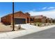 Single-story house with neutral desert landscape, a driveway, and tile roof at 1398 Pin Cushion Rdg, Mesquite, NV 89034
