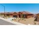 Charming single-story home with desert landscaping, two-car garage, and welcoming arched entryway at 1398 Pin Cushion Rdg, Mesquite, NV 89034