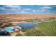 Scenic view of the golf course with a pond, pool, and desert mountains in the background at 1398 Pin Cushion Rdg, Mesquite, NV 89034