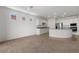 Well-lit kitchen with stainless steel appliances, gray granite countertops, and ample white cabinetry at 1398 Pin Cushion Rdg, Mesquite, NV 89034