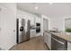 Kitchen featuring stainless steel appliances, granite countertops, and white cabinetry providing ample storage at 1398 Pin Cushion Rdg, Mesquite, NV 89034