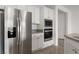 Modern kitchen features stainless steel refrigerator, microwave, and oven at 1398 Pin Cushion Rdg, Mesquite, NV 89034