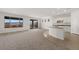 Bright open floor plan with large windows, recessed lighting, neutral carpet and tile flooring at 1398 Pin Cushion Rdg, Mesquite, NV 89034