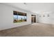 Bright, carpeted living room with large windows at 1398 Pin Cushion Rdg, Mesquite, NV 89034
