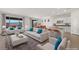 Bright living room with modern furniture and a large sliding glass door showcasing scenic mountain views at 1398 Pin Cushion Rdg, Mesquite, NV 89034