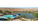 Scenic community pool overlooking a lake and golf course with desert views at 1398 Pin Cushion Rdg, Mesquite, NV 89034