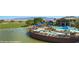 Community center featuring a pool, hot tub, and beautiful waterfront views at 1398 Pin Cushion Rdg, Mesquite, NV 89034