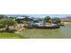 Community center and pool area offering picturesque lakeside views and landscaping at 1398 Pin Cushion Rdg, Mesquite, NV 89034
