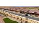 Scenic street view of homes with desert landscaping, clear blue sky and mountain views at 1398 Pin Cushion Rdg, Mesquite, NV 89034