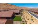 Scenic street view of single-story homes with well-maintained landscaping and a clear blue sky in a desert community at 1398 Pin Cushion Rdg, Mesquite, NV 89034