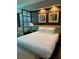 Bedroom featuring a bed with white linens, and wall art at 145 E Harmon Ave # 2409, Las Vegas, NV 89109