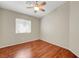Bedroom featuring sleek wood flooring and a modern ceiling fan at 1574 Ward Frontier Ln, Henderson, NV 89002