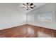 Spacious bedroom with laminated wood floors, natural light and ceiling fan at 1574 Ward Frontier Ln, Henderson, NV 89002